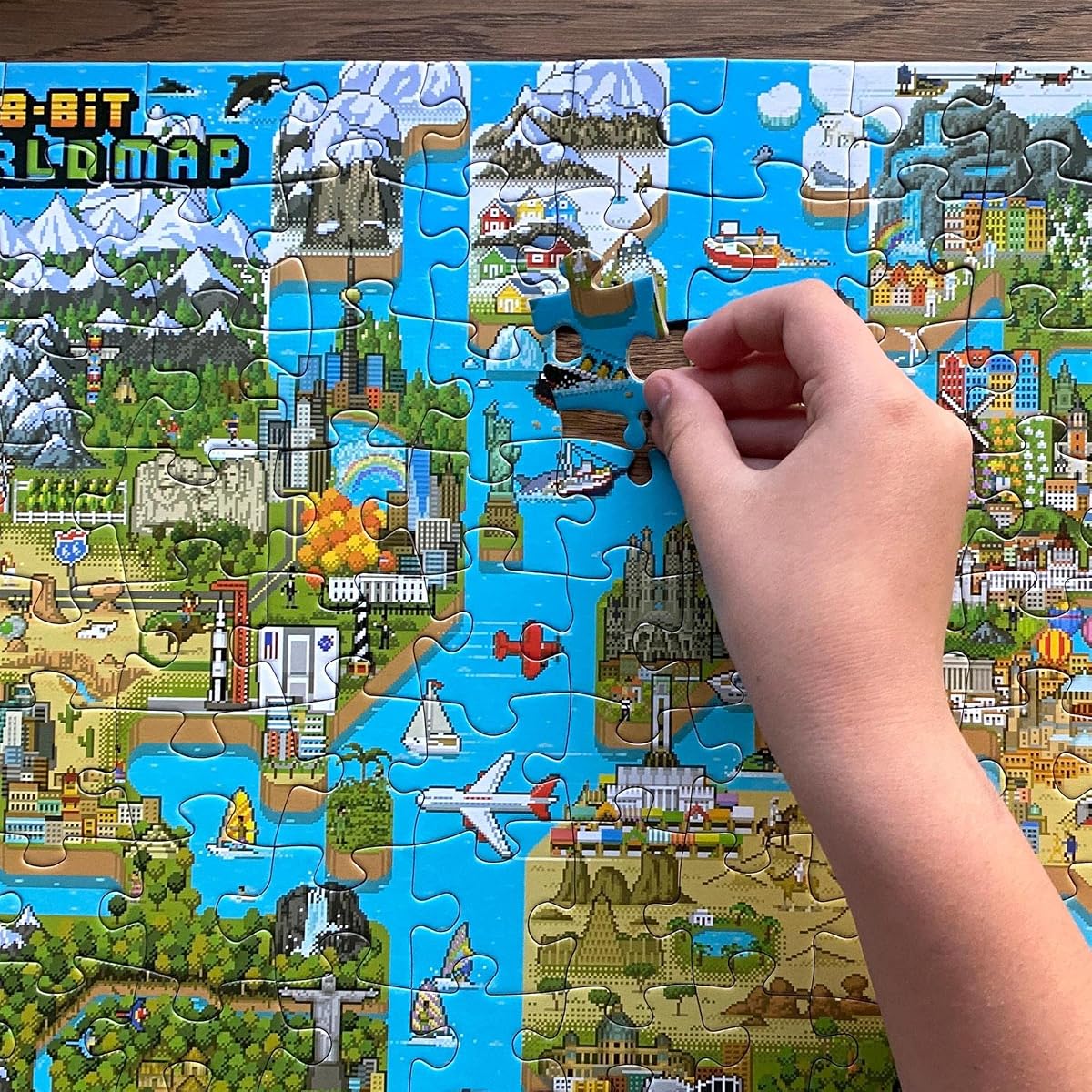 bopster 8-Bit World Map Puzzle — 180 Pieces next to its box